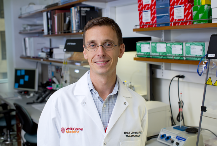 a man posing for a portrait in a lab