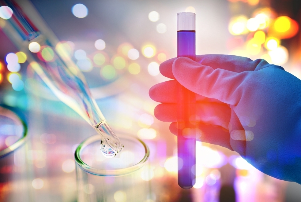 someone holding a test tube